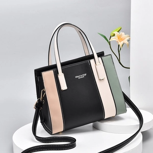 Women's tricolor patchwork leather handbag with top handles and adjustable shoulder strap