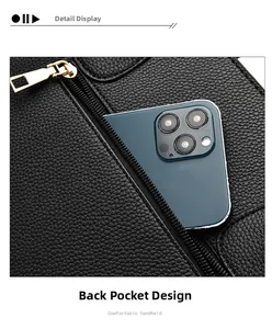 Detail of the back zipper pocket on lychee grain leather bag with a smartphone inside