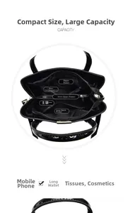 Macro view of the multi-compartment interior layout in a high-gloss black leather tote bag