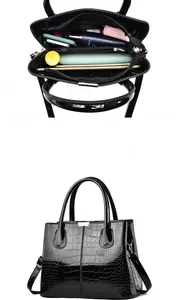 Detailed interior compartments and crocodile texture of black large tote bag