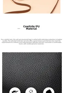Close-up of black litchi texture leather bag with contrast brown shoulder strap