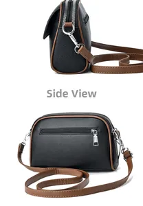 Side and back view of a black pebble leather crossbody bag with brown trim and dual zippers