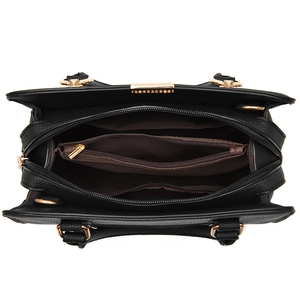 Structured black pebble leather handbag with gold hardware and spacious interior compartments