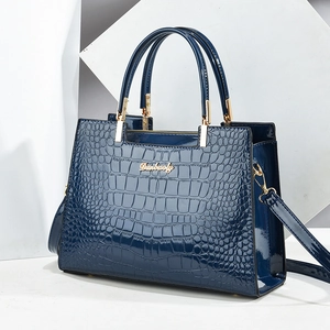 Glossy dark blue crocodile embossed patent leather handbag with gold metal hardware