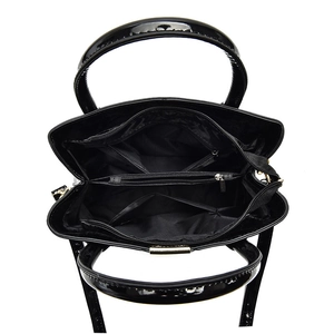 Large black patent leather handbag with spacious multi-compartment interior storage
