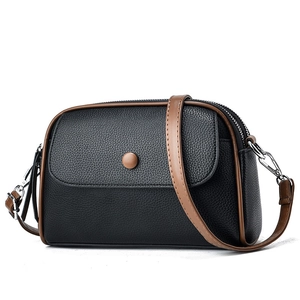 Mini crossbody phone bag for women in black lychee texture leather with brown contrast trim