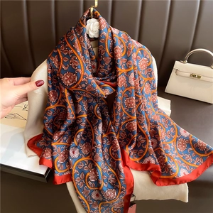 Luxurious floral vine silk scarf in navy blue with vintage orange and white daisy pattern