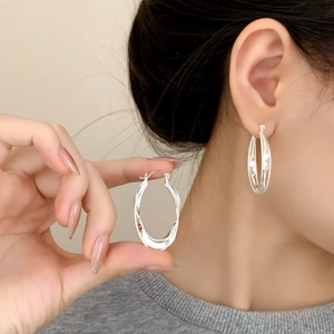 Exquisite geometric layered twist hoop earrings in silver finish with bead texture details