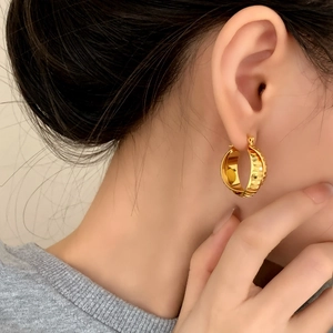 Fashionable gold hoop earrings featuring elegant horizontal textured stripes for women