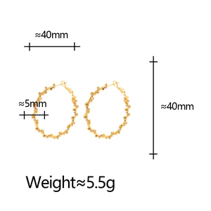 Golden irregular geometric hoop earrings with sparkling flower cluster crystal inlay