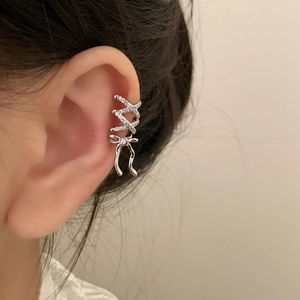 Silver bow ear bone clip with double-layer pavé lines worn by a female model