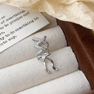 Elegant silver bow ear cuff with sparkling rhinestones in a luxury gift box display
