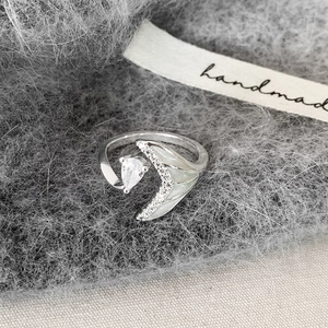 Elegant silver open ring featuring a crystal teardrop stone and a crescent moon with pearls