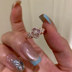 Rose gold adjustable ring featuring pink mother of pearl four leaf clover and cubic zirconia