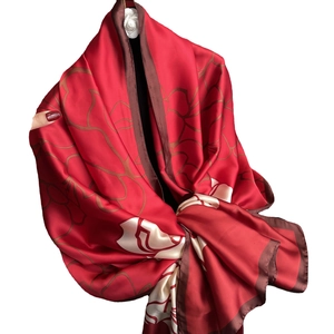 Luxurious red silk shawl with large brown floral patterns and elegant white block detail