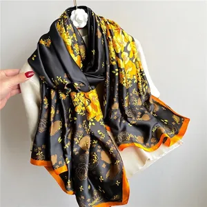 Satin floral scarf with yellow roses and orange edges for a luxury fashion accessory