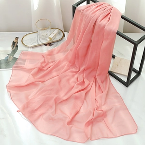 Detail of light pink chiffon scarf with silk metallic texture and subtle vertical stripes