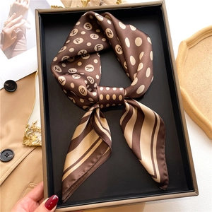 Brown satin scarf with polka dots and stripes presented in an elegant gift box