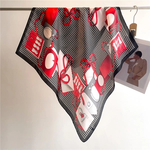 Detail of silk-like houndstooth scarf with fashion illustrations and red ribbon motifs