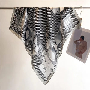Detail of elegant houndstooth silk scarf with illustration and draped texture