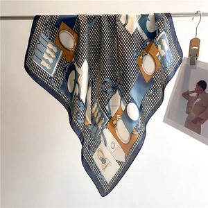 Elegant houndstooth silk scarf with vintage orange accents and classic fashion motifs