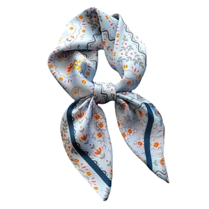 Floral satin square scarf in light blue with orange flower prints and bow styling