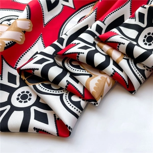 Detailed macro view of soft twill silk fabric texture with cat and geometric prints