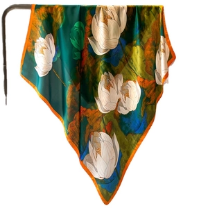 Deep green silk square scarf featuring elegant white lotus print and orange hem