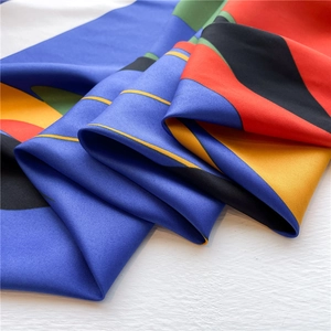 Colorful geometric print twill silk scarf with bold red and royal blue blocks