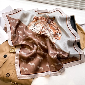 Detailed texture of an elegant silk square scarf with zebra and nature patterns