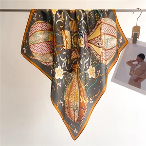 Detail of hanging silk scarf with hot air balloon pattern and elegant fabric drape