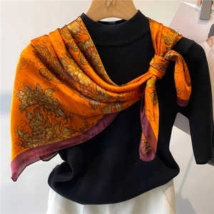 Classic orange faux silk scarf with floral patterns on black knit top 90cm shawl
