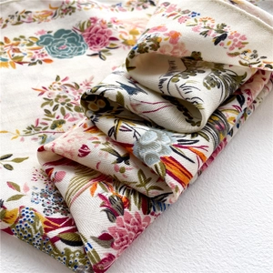Macro view of floral pattern print and herringbone weave texture on elegant silk scarf