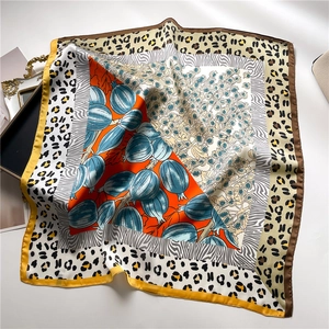 Silk-like square scarf featuring leopard and zebra prints with orange floral patterns