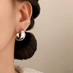 Minimalist silver wide double-hoop C-shaped earrings with a polished mirror finish for women