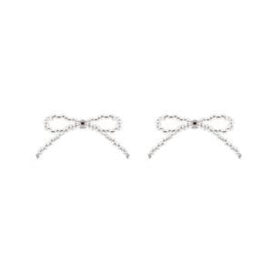 Detailed view of clear beaded bow earrings with central silver bead on white background