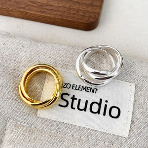 Minimalist multi-layer interlocking rings in gold and silver with a high-polished finish