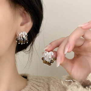 French style tiger eye stone tassel earrings with silver woven design on model