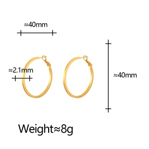 Macro view of 40mm golden matte geometric hoop earrings with precise size measurements