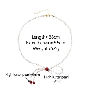 Collier de perles de style français avec nœud et détails rouges, longueur 38cm