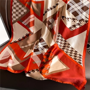 Luxurious plaid colorblock satin scarf with houndstooth pattern draped elegantly