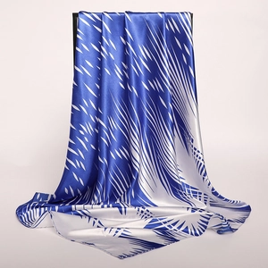 Close-up of blue and white ink style satin scarf with detailed abstract stripe texture