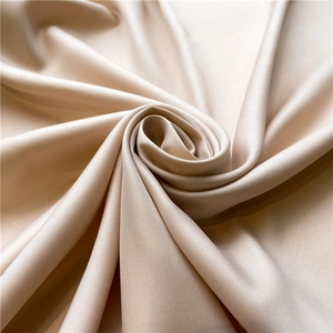 Detailed macro view of champagne twill silk scarf showing smooth texture and satin sheen
