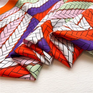 Silk feel square scarf with colorful braided rope print and vibrant color blocking design