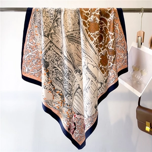 Detail of elegant silk square scarf with vintage architectural print and blue border