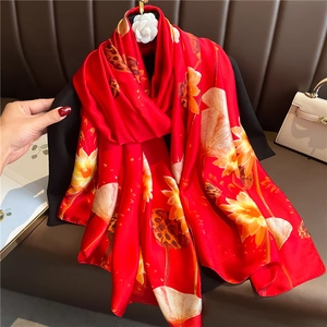 Luxurious red silk scarf with lotus print and elegant floral pattern for women