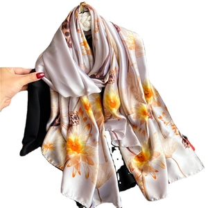 Luxurious purple silk scarf with yellow lotus pond floral print in a long drape style