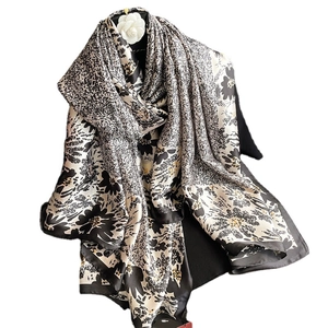 Luxurious black and white floral silk scarf with polka dots and white camellia flower