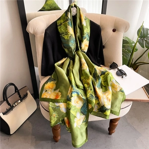 Luxurious long silk scarf with yellow lotus print and green borders for sun protection