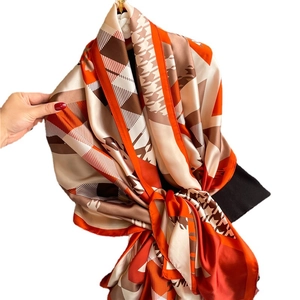 Luxury geometric color-block silk shawl featuring houndstooth pattern and satin finish